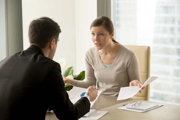 angry-businesswoman-arguing-with-businessman.webp