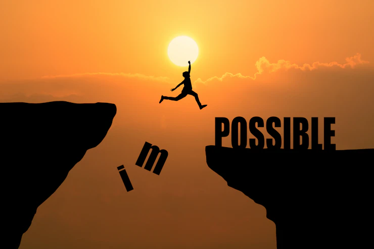 man-jumping-impossible-possible-cliff-sunset-background-business-concept-idea.webp