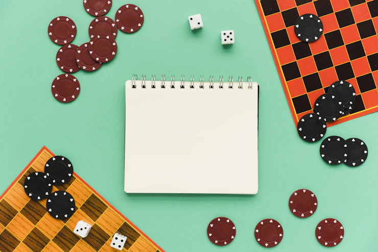 top-view-society-games-with-mock-up-notepad.webp